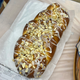 Raspberry cheese danish with lemon glaze and almonds